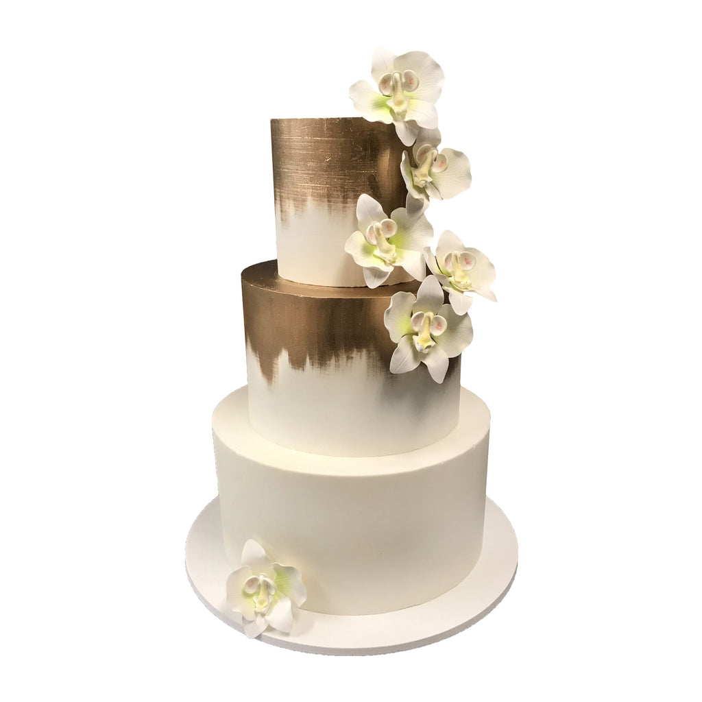 Three tiered wedding cake covered with ivory fondant hand painted edible gold and sugar-paste orchids